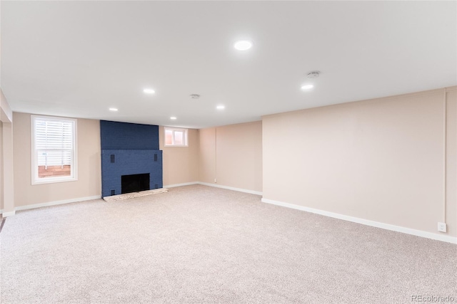 5384 S Datura St, Littleton, CO 80120 - below grade area with recessed lighting, a fireplace, and light colored carpet