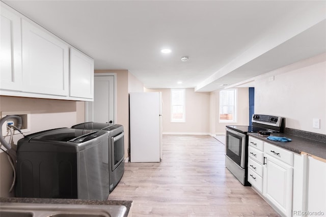 5384 S Datura St, Littleton, CO 80120 - kitchen featuring stainless steel electric stove, freestanding refrigerator, washer / clothes dryer, light wood-style floors, and recessed lighting