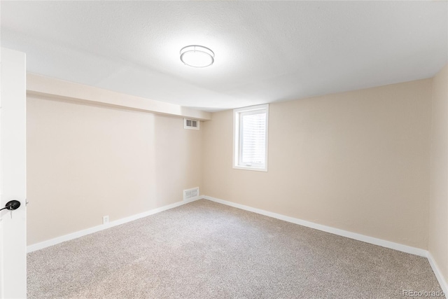 5384 S Datura St, Littleton, CO 80120 - below grade area with carpet flooring and a textured ceiling