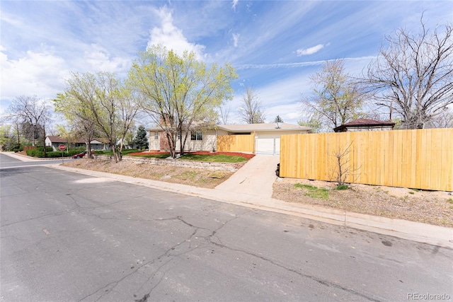 5384 S Datura St, Littleton, CO 80120 - view of front of home with a garage and concrete driveway