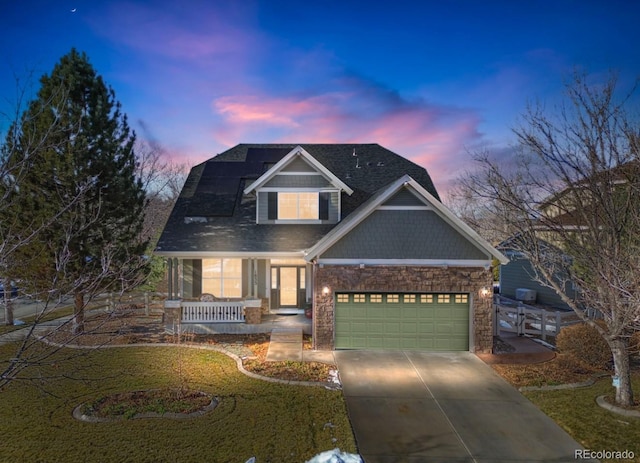 craftsman inspired home with a garage and a porch