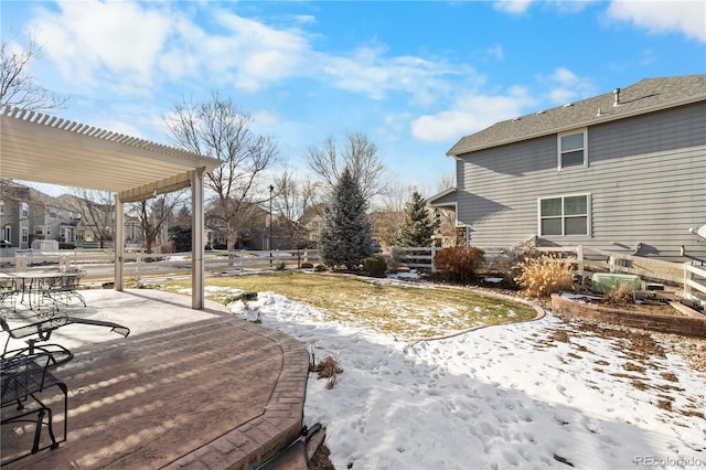 yard covered in snow featuring a patio area and a pergola