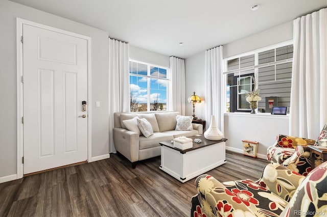 living room with baseboards and dark wood finished floors