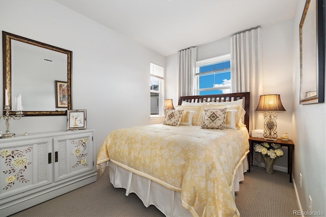 carpeted bedroom with baseboards