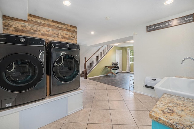 9075 Jill Dr, Conifer, CO 80433 - laundry room featuring washing machine and dryer, wood walls, recessed lighting, and tile patterned floors