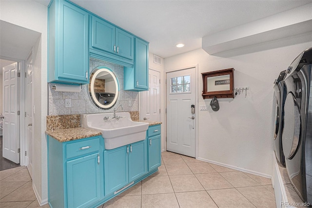 9075 Jill Dr, Conifer, CO 80433 - laundry area featuring separate washer and dryer, cabinet space, light tile patterned floors, and recessed lighting