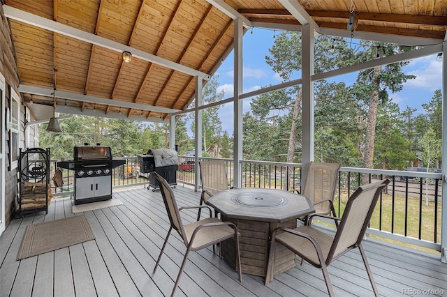 9075 Jill Dr, Conifer, CO 80433 - sunroom / solarium featuring outdoor dining area, plenty of natural light, and view of scattered trees