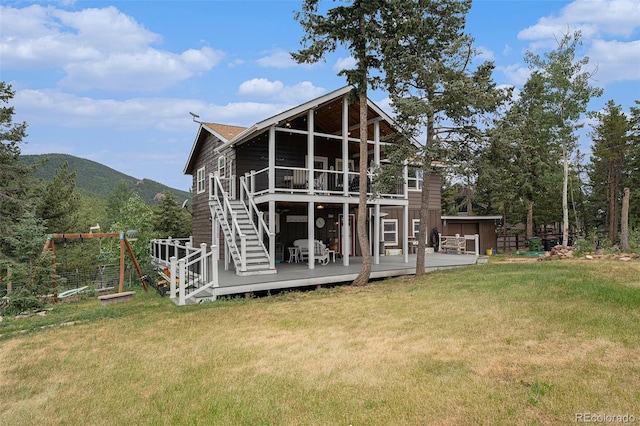 9075 Jill Dr, Conifer, CO 80433 - rear view of property with a yard, a deck with mountain view, and a balcony