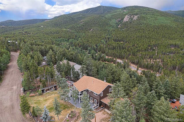 9075 Jill Dr, Conifer, CO 80433 - view of subject property with a heavily wooded area and mountains