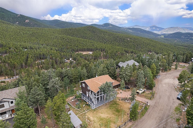 9075 Jill Dr, Conifer, CO 80433 - drone / aerial view of a forest and mountains
