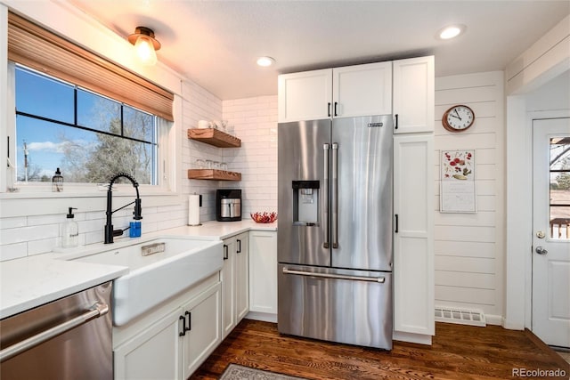 6361 S Spotswood Cir, Littleton, CO 80120 - kitchen with stainless steel appliances, backsplash, white cabinetry, light countertops, and recessed lighting