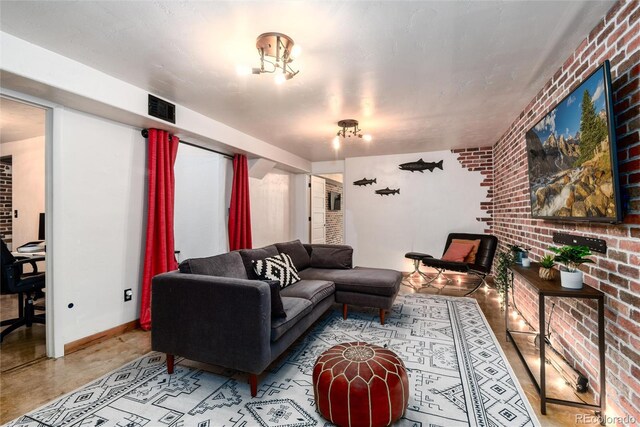 6361 S Spotswood Cir, Littleton, CO 80120 - living room featuring brick wall and baseboards