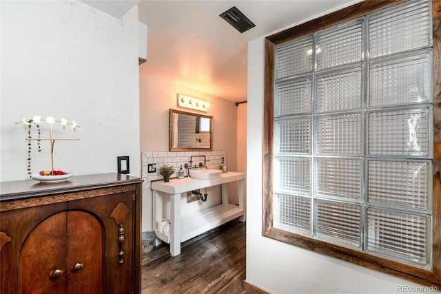 6361 S Spotswood Cir, Littleton, CO 80120 - bathroom with wood finished floors and backsplash