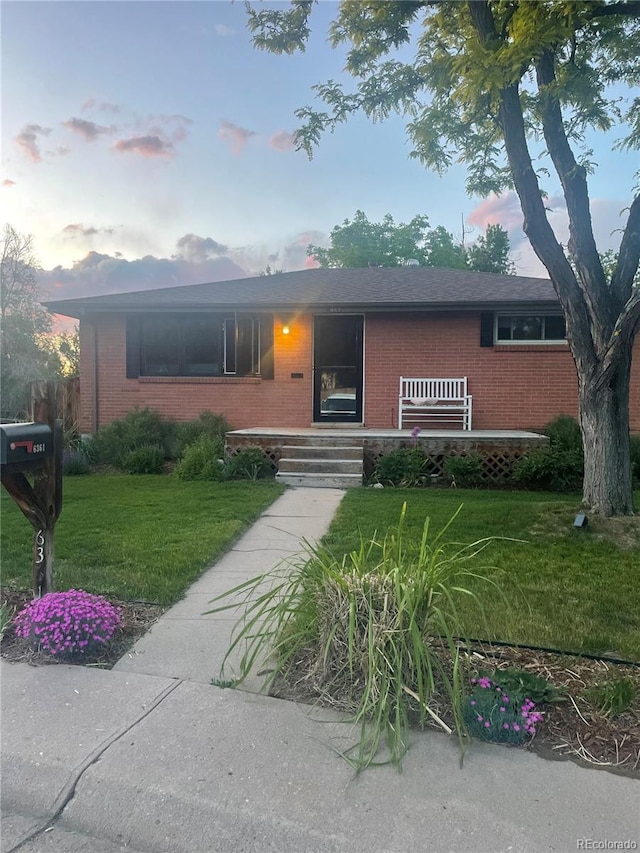 6361 S Spotswood Cir, Littleton, CO 80120 - ranch-style house featuring brick siding and a yard