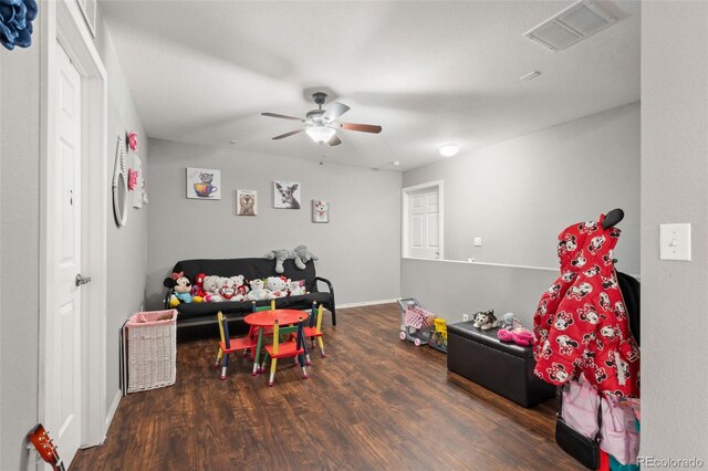 rec room with ceiling fan and dark hardwood / wood-style flooring