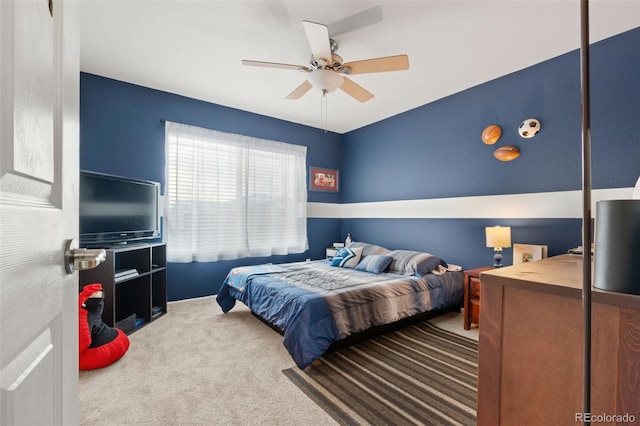bedroom with ceiling fan and carpet