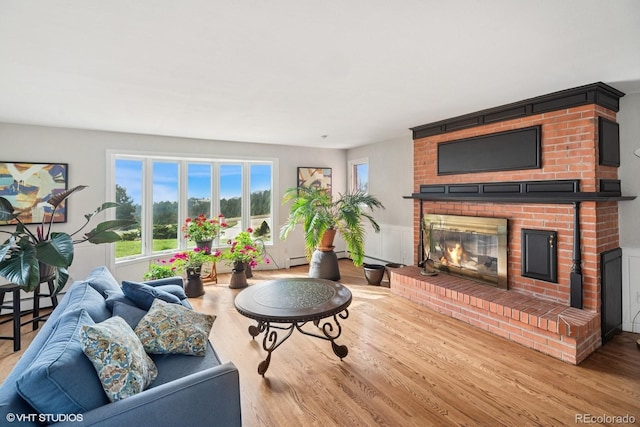 22081 Paradise Cir, Golden, CO 80401 - living area with a brick fireplace and wood finished floors