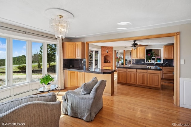22081 Paradise Cir, Golden, CO 80401 - living room featuring light wood finished floors, a chandelier, and ceiling fan