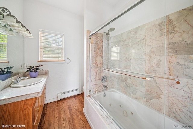 22081 Paradise Cir, Golden, CO 80401 - bathroom featuring baseboard heating, plenty of natural light, wood finished floors, and a combined bath / shower with jetted tub