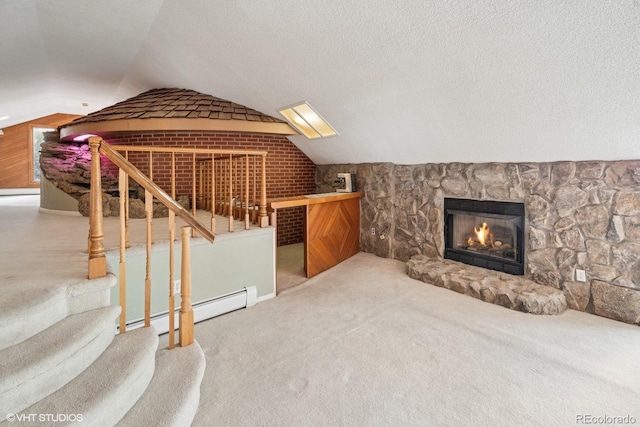 22081 Paradise Cir, Golden, CO 80401 - bonus room featuring baseboard heating, vaulted ceiling, carpet flooring, a warm lit fireplace, and stairway