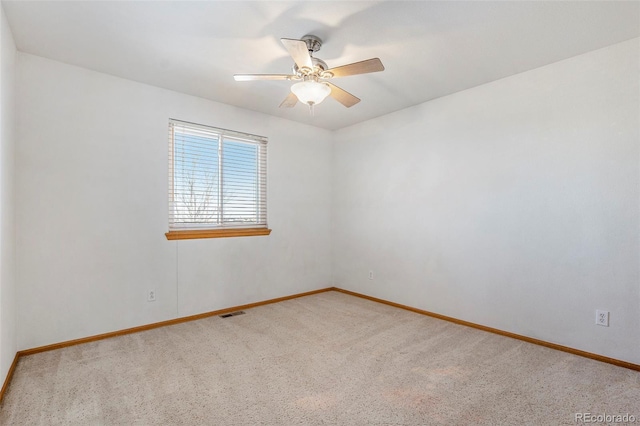 empty room with carpet floors and ceiling fan