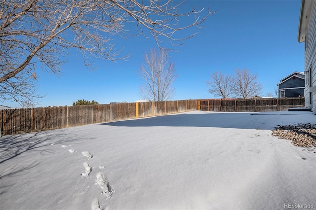 view of yard covered in snow