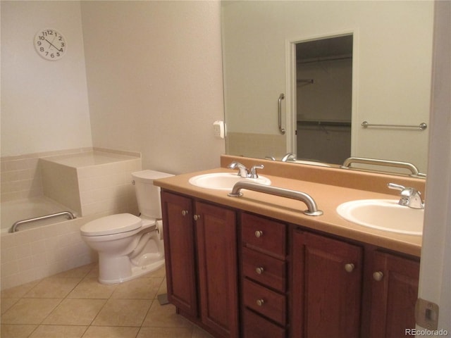 bathroom featuring vanity, tile patterned floors, and toilet