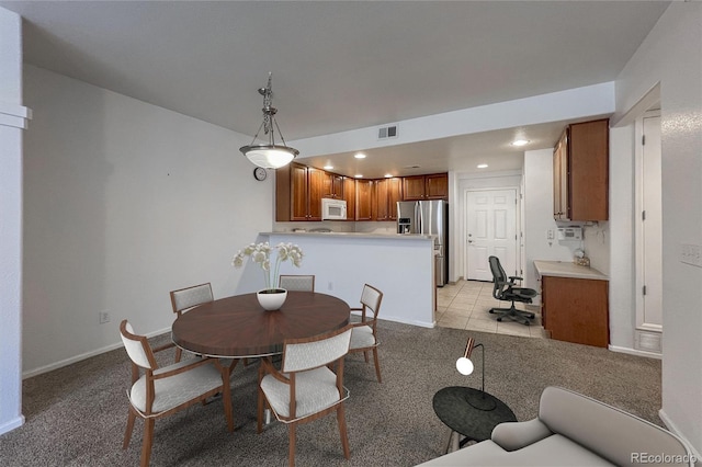 dining area with light carpet