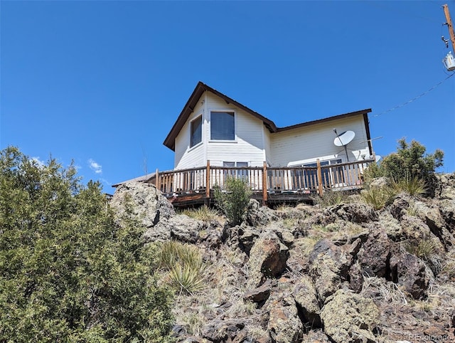 rear view of property with a deck