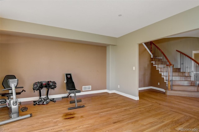 exercise area featuring light hardwood / wood-style flooring