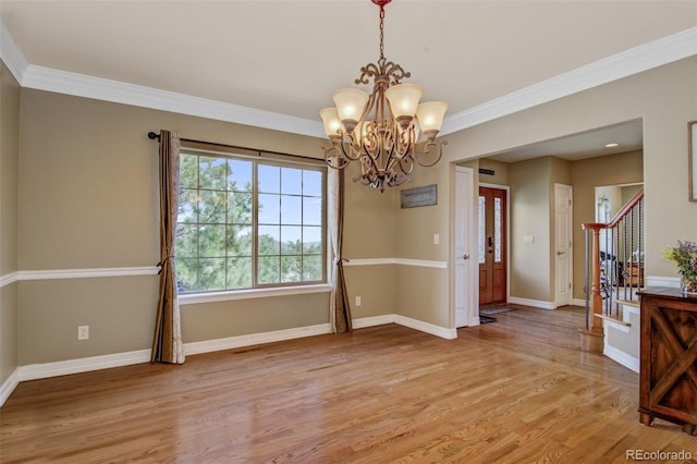 interior space with crown molding, a notable chandelier, and light wood-type flooring