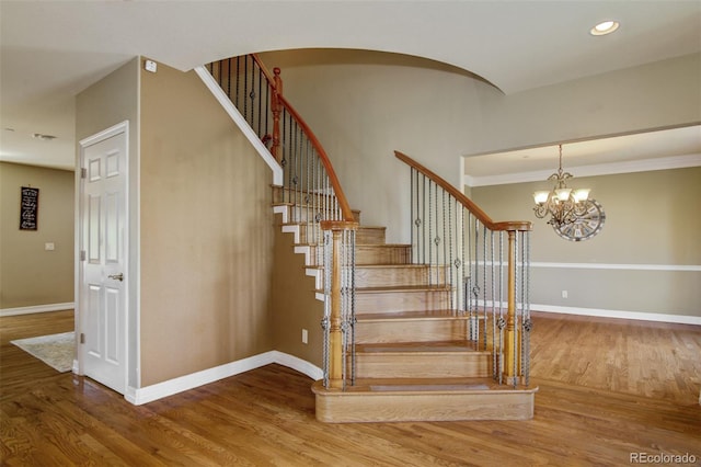 stairway with hardwood / wood-style flooring