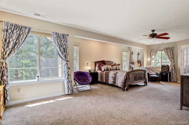 bedroom featuring light colored carpet and ceiling fan