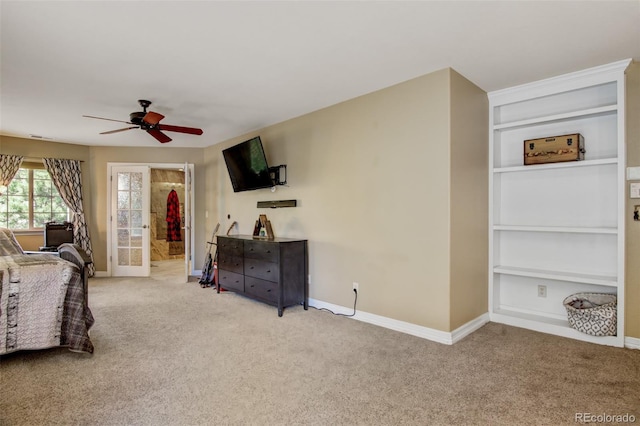 living room featuring light carpet, ceiling fan, and french doors