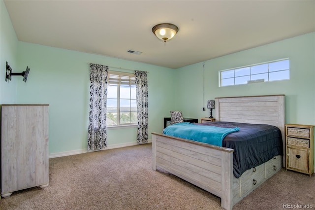 bedroom featuring light colored carpet