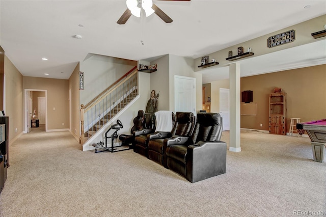 carpeted living room featuring ceiling fan