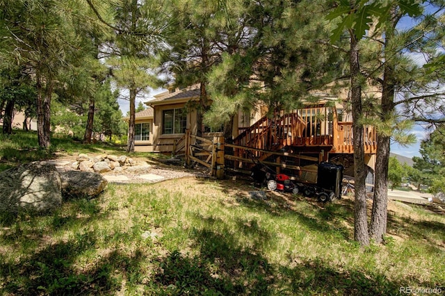 back of house featuring a deck