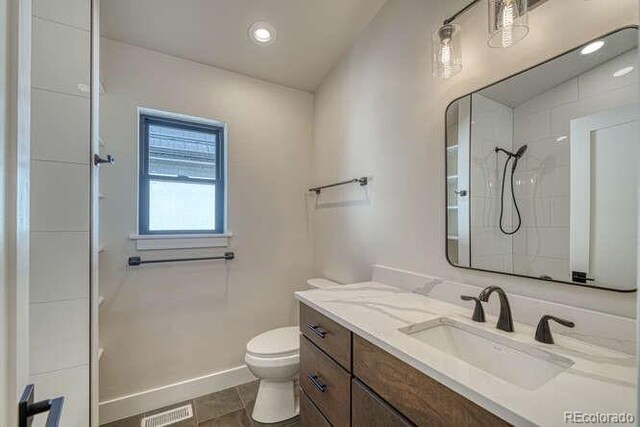 136 Chase St, Salida, CO 81201 - full bathroom featuring toilet, vanity, a shower, recessed lighting, and baseboards