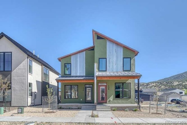 136 Chase St, Salida, CO 81201 - view of front facade with a porch, a mountain view, metal roof, and a standing seam roof