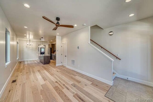 136 Chase St, Salida, CO 81201 - unfurnished living room featuring recessed lighting, a ceiling fan, stairway, baseboards, and light wood-type flooring