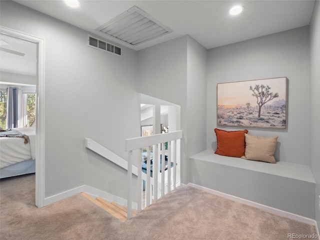 stairway with carpet floors, baseboards, visible vents, and recessed lighting