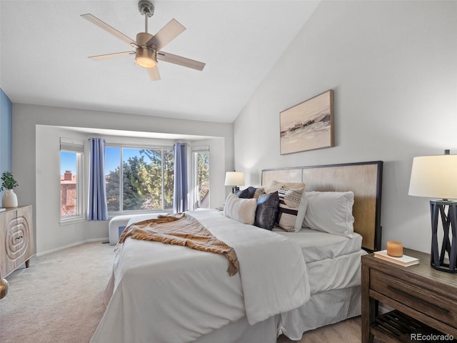 carpeted bedroom with lofted ceiling, ceiling fan, and baseboards