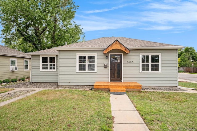 5100 Clay St, Denver, CO 80221 - bungalow-style home with a front lawn, cooling unit, and roof with shingles
