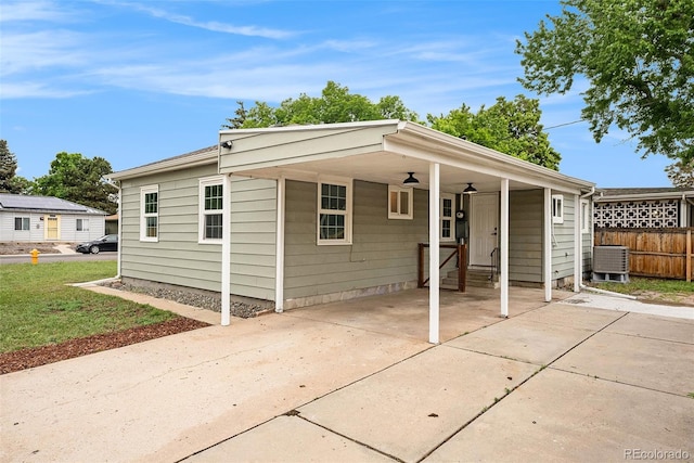 5100 Clay St, Denver, CO 80221 - view of front facade with central AC and an attached carport