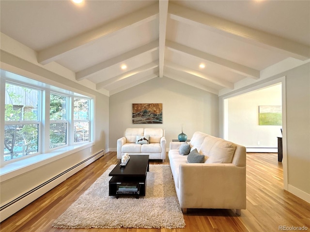 living room with vaulted ceiling with beams, light hardwood / wood-style flooring, and a baseboard heating unit