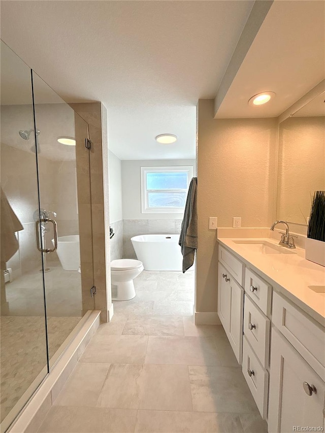 full bathroom with tile patterned floors, vanity, plus walk in shower, and toilet