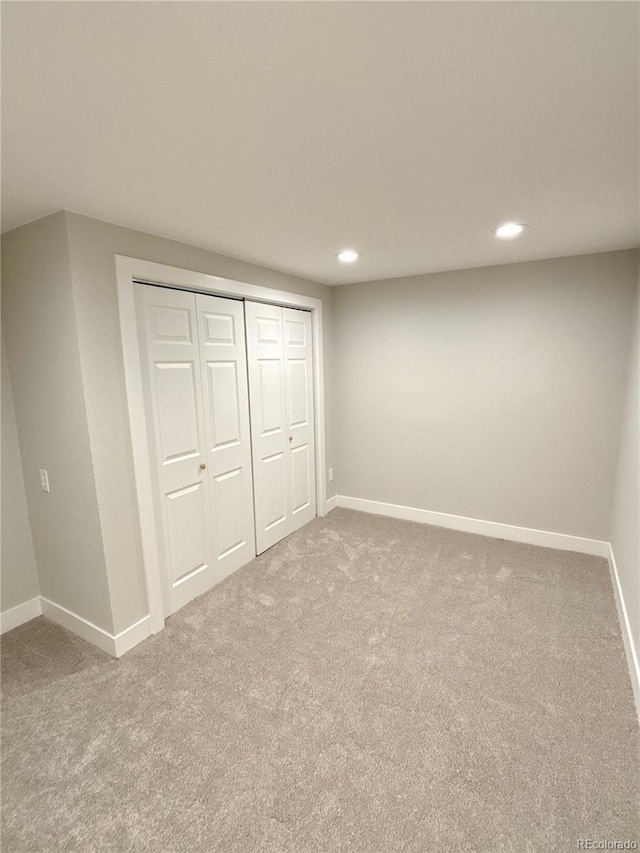 unfurnished bedroom featuring a closet and carpet