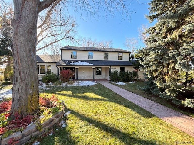 front facade with a front yard