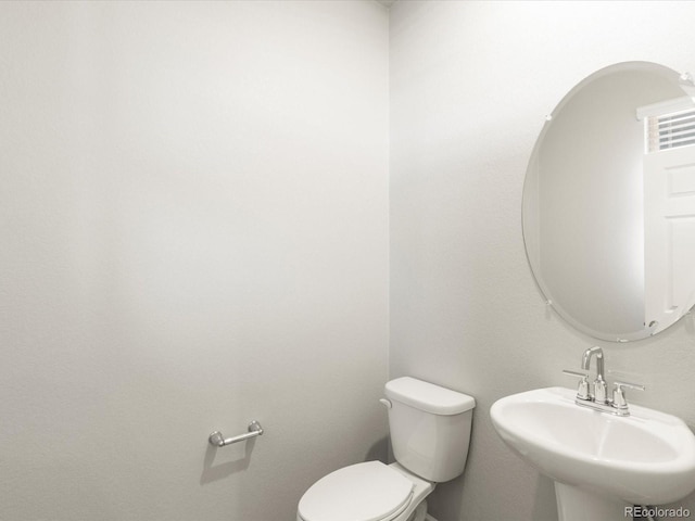 bathroom with sink and toilet