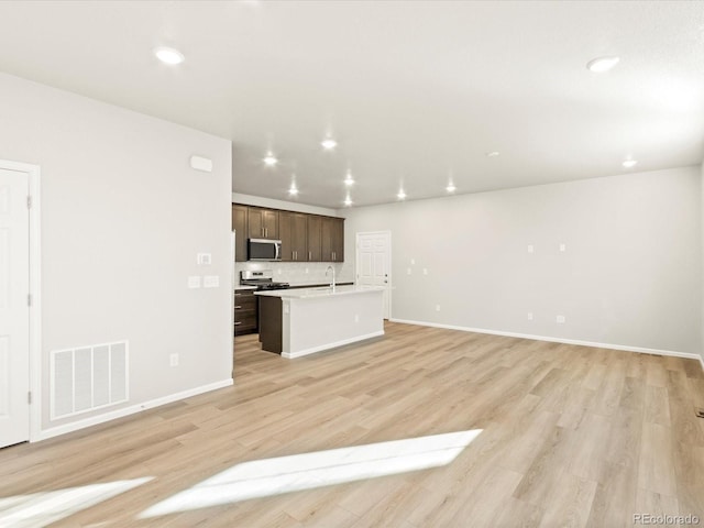 unfurnished living room with light wood-type flooring